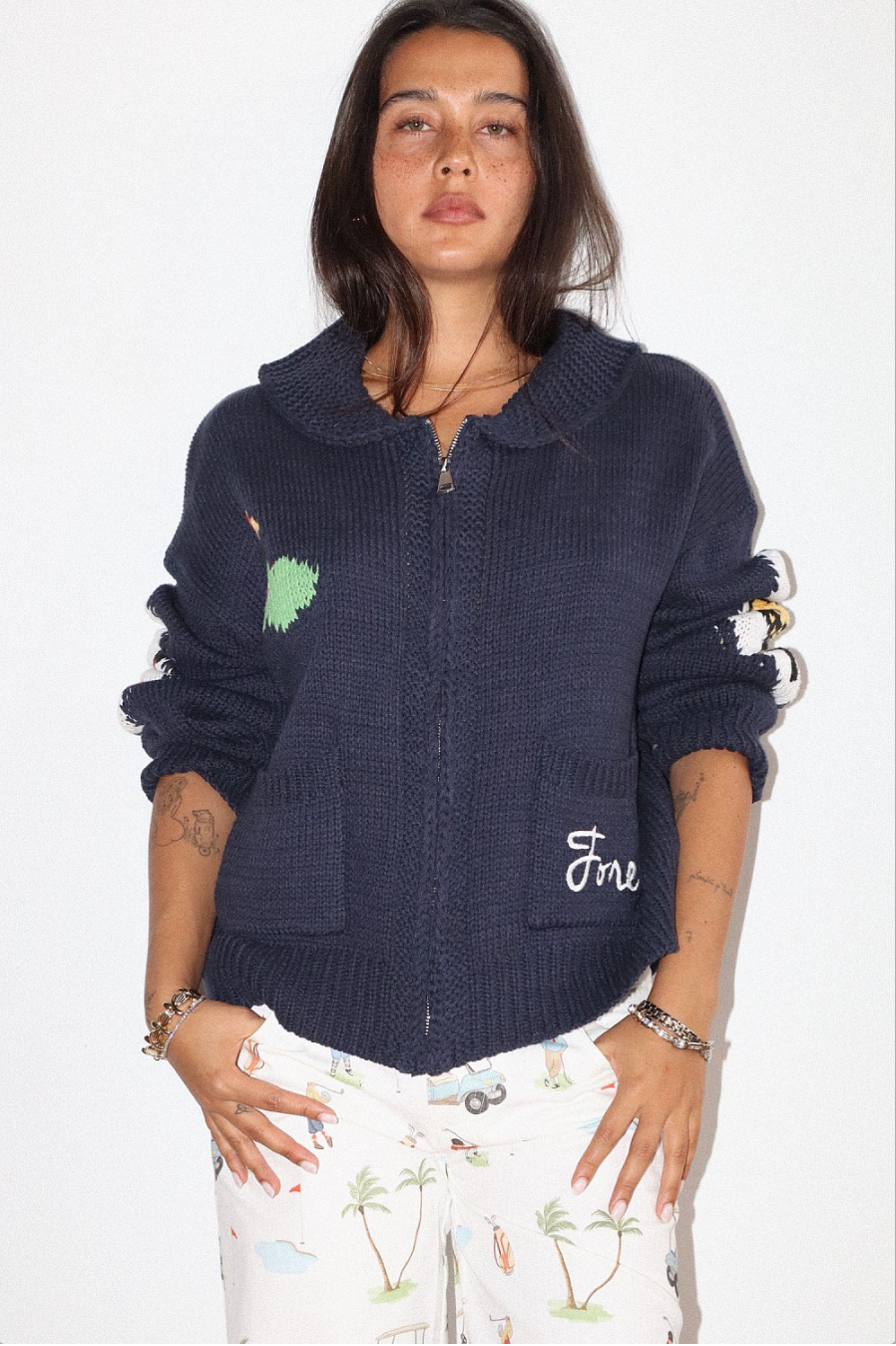 HOLE IN ONE ZIP SWEATER